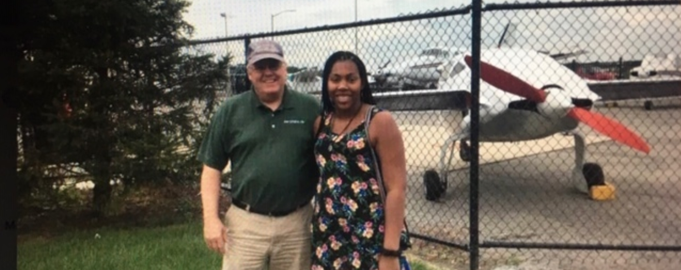 Angela Wright and her father next to a plane