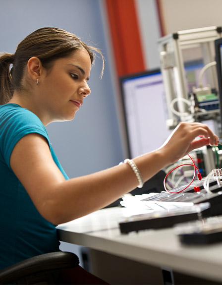 Female student working in Computer-Aided Design lab