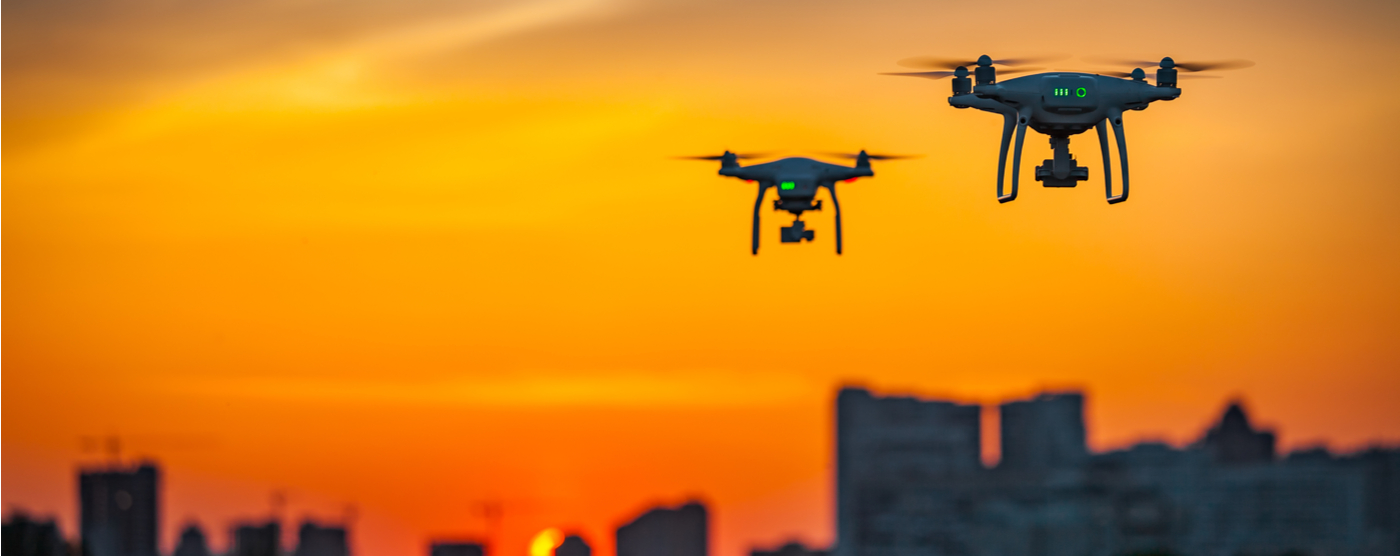 Drones flying safely at sunset
