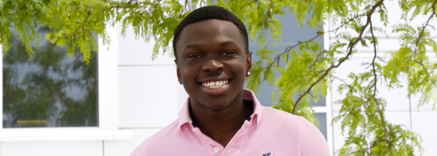 Terry smiling in pink shirt for student ambassadors