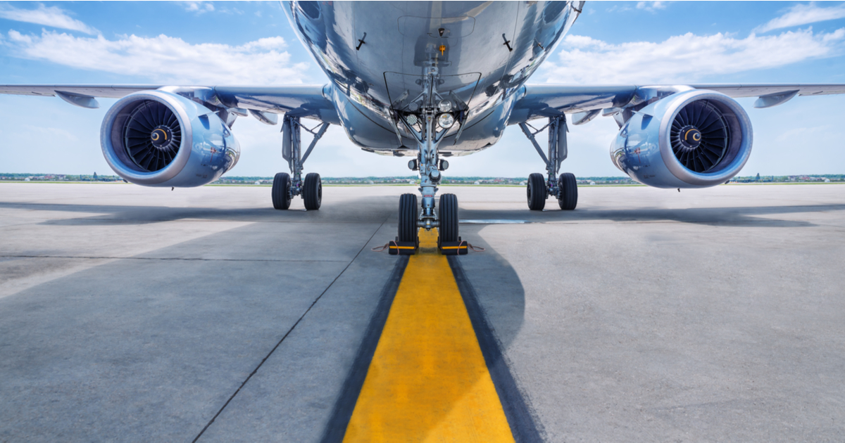 The underbelly of a plane on a runway