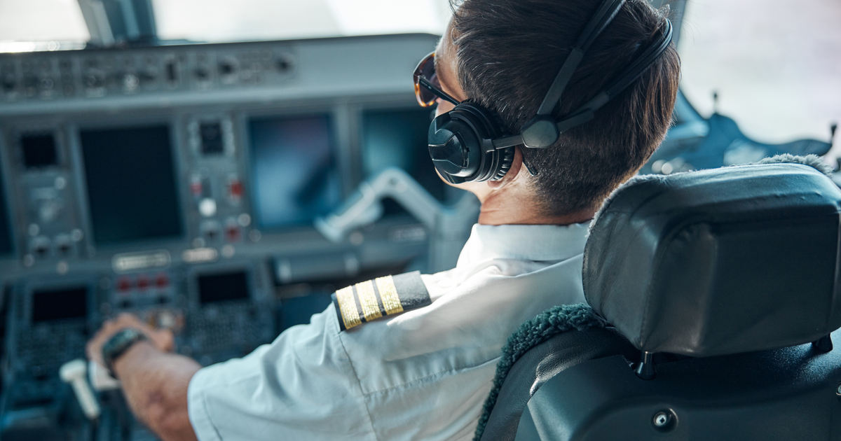 Pilot in cockpit of plane