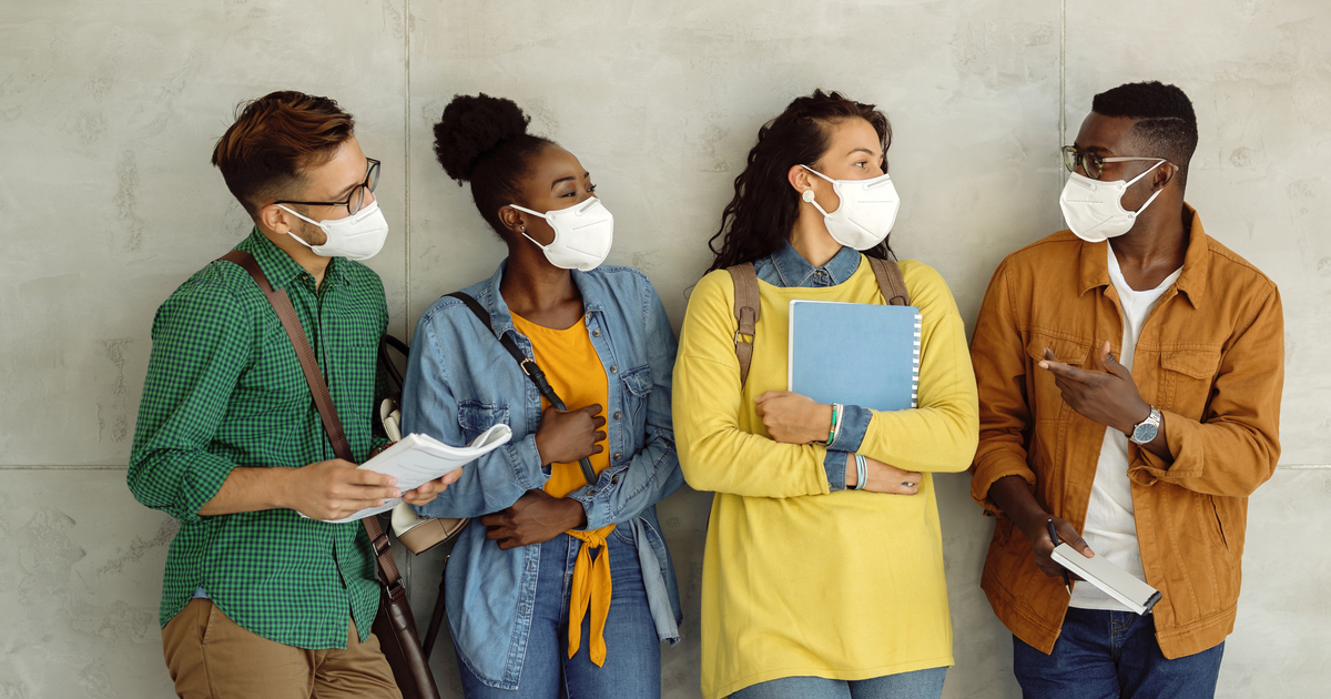 Students on campus wearing masks