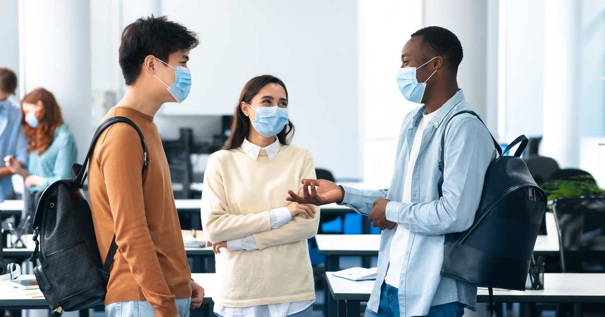 College students wearing masks staying engaged