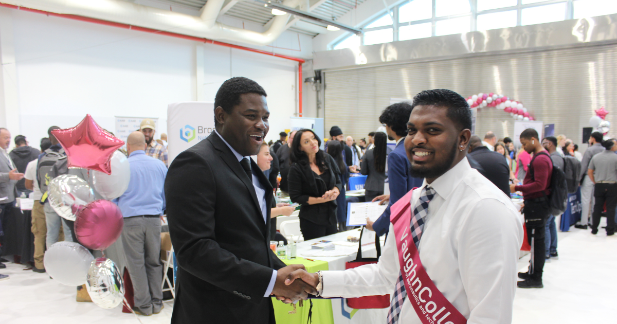 student making connections with employers at Vaughn career fair