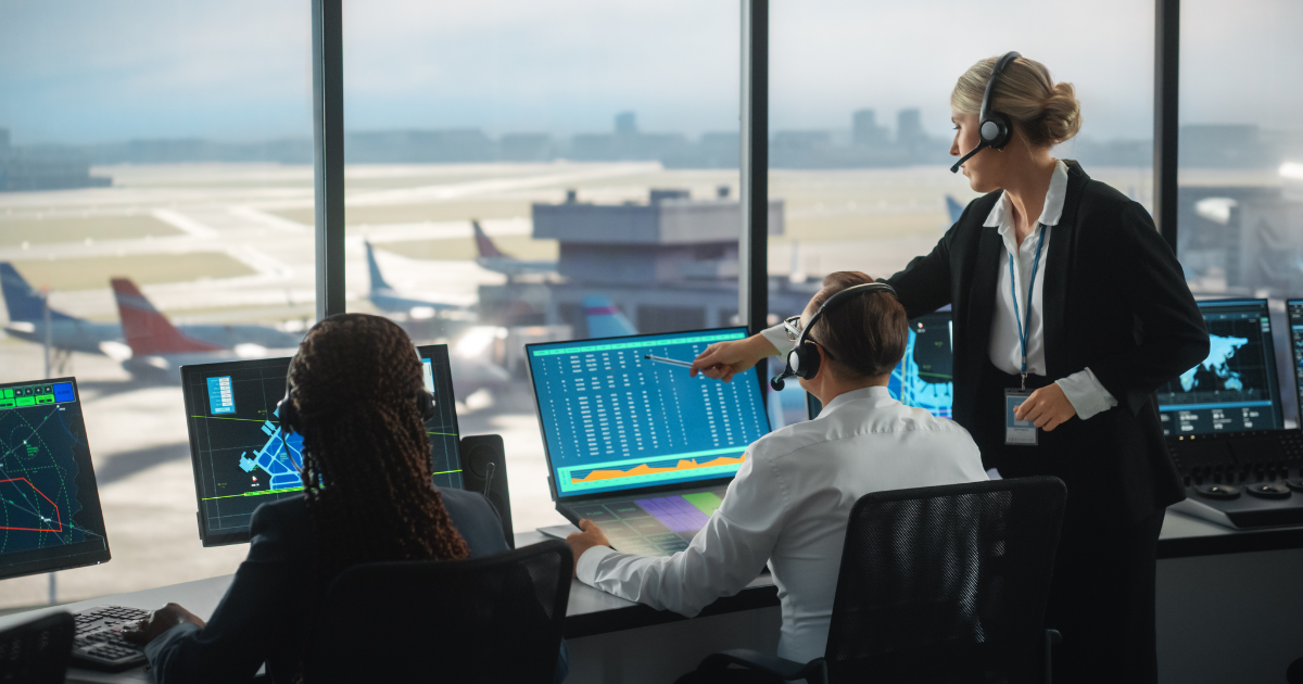 Air traffic controllers in the tower bringing planes in